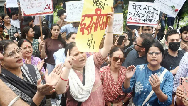 Demonstrators holding placards during Dehradun Protest Against Delhi Lathi Charge demanding resignation of Union Education Minister.