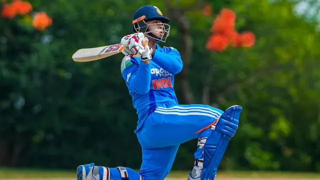 Young Indian cricketer Vaibhav Suryavanshi warming up on the field during an international match.